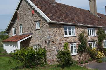 Whitehall Farm Cottage is half of an historic farmhouse in a wonderful setting overlooking the Otter Valley in East Devon.