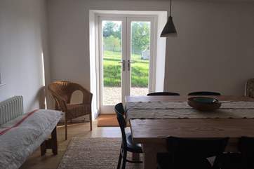 There is a separate dining room with French windows to the patio and lawned gardens. This is the room to the left from the entrance hall.
