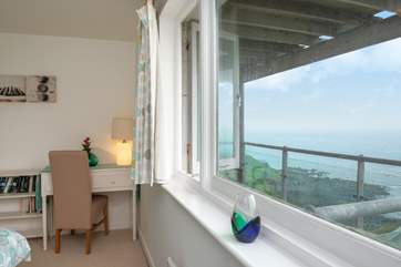 There is a shared balcony between two bedrooms.