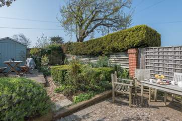This pretty enclosed patio is a lovely spot to relax in the Island sunshine