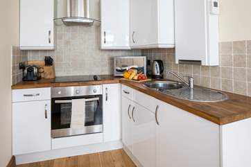 The annexe kitchen is compact and well-equipped with everything you will need.