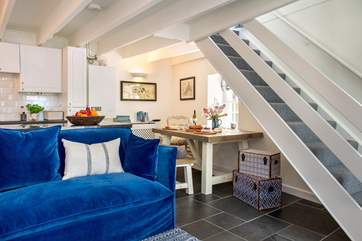 The stairs lead up from the sitting area
