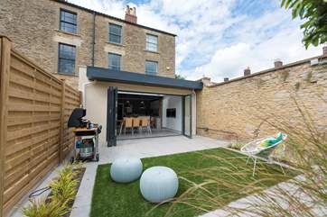 This stunning Georgian town house has a walled garden and floor to ceiling bi-fold doors that create a wonderful inside/outside space.
