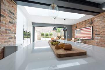 A huge island/breakfast-bar is the focal point of this sociable living space.