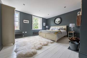 This is the fabulous master bedroom on the first floor. It looks out to the front of the house and has the treat of a wood-burning stove.