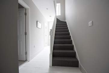 The stairs rise up from the entrance hall, There are two bedrooms and a shower-room on the first floor and a further two bedrooms and bathroom on the second floor.