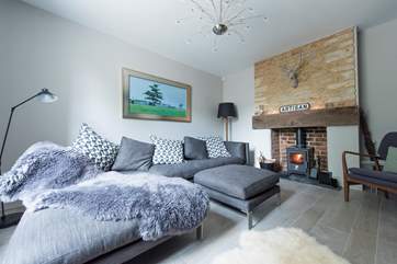 The sumptuous living-room with its wood-burning stove is another totally relaxing space to enjoy.