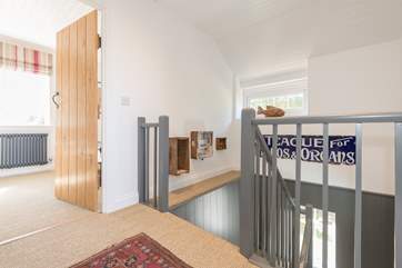 The first floor landing leading to the two double bedrooms either side and the family bathroom.