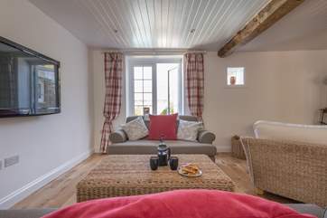 The patio doors lead towards the pool.