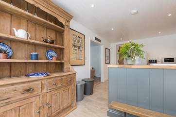 The open doorway from the well-equipped kitchen to the living-room.