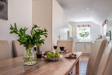 The kitchen/dining-room has doors leading out to the garden.