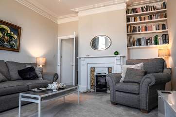 The log-effect electric fire makes the sitting-room a warm and inviting room all year round.