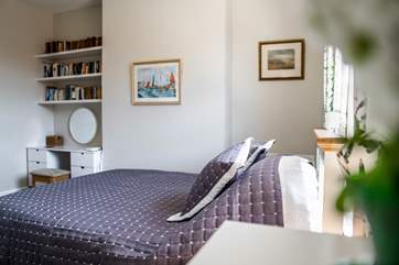 The beautifully furnished master bedroom.