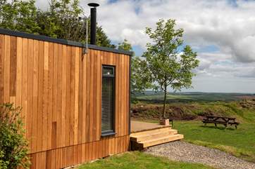There are gorgeous far-reaching views over countryside to the sea in the distance.