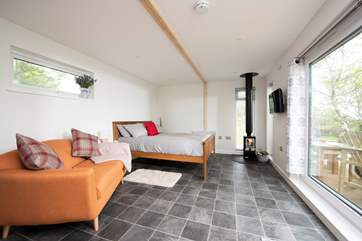 The living area is spacious, with sliding patio doors that allow the natural light in.