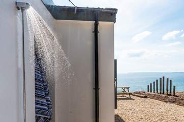 The outdoor shower is ideal for rinsing off sandy dogs and bodies.