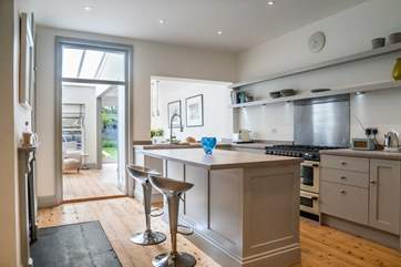 The kitchen provides a great social space for both cooking and chatting.