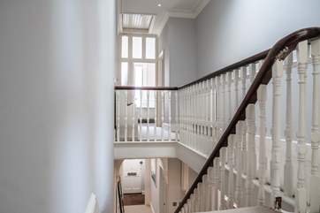 The open plan staircase leads to the three double bedrooms.
