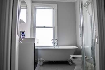 Unwind after a day on the beach in the roll-top bath, adjacent to the master bedroom.