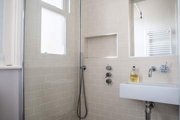 The contemporary shower-room is in between bedrooms one and two.