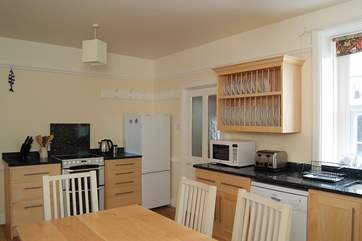 The bespoke hand-made maple kitchen has beautiful granite worktops.