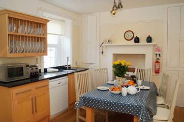 The spacious oak floored kitchen/dining-room.