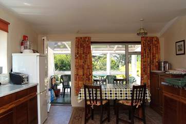The very well-equipped kitchen leads through to the sunny conservatory.