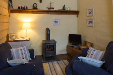 A gas-fired wood-burner style stove keeps this lovely cottage warm and cosy.