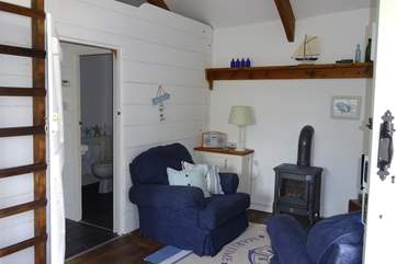 A gas-fired wood-burner style stove keeps this lovely cottage warm and cosy.