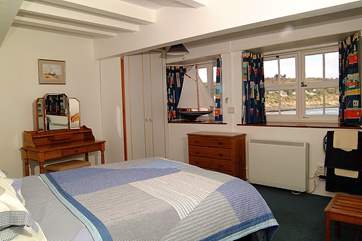 The ground floor double bedroom with an en suite shower cubicle and fabulous sea views.