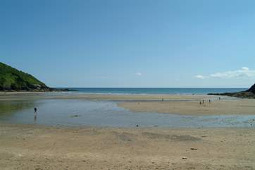 Caerhays (Porthluney) beach has a little beach cafe and parking right next to the sands.