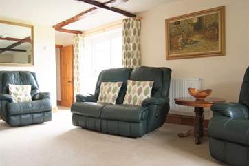 The sofas and armchair are all recliners, perfect for relaxing after a day out exploring.