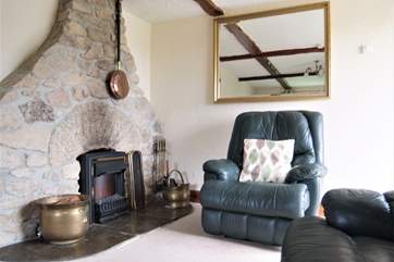 There is a cosy coat-effect fire but the open fire is also available if preferred.