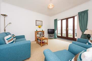The sitting-room has French doors onto a balcony.