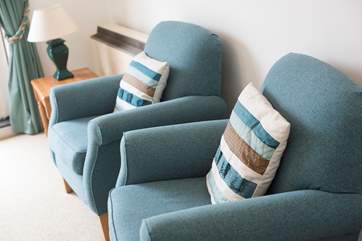 Pretty soft furnishings add touches of colour.
