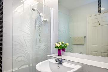 Enjoy a soak in the family bathroom.