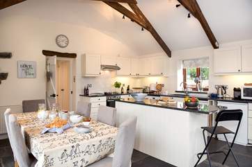 The kitchen dining room is a wonderful room which overlooks the patio