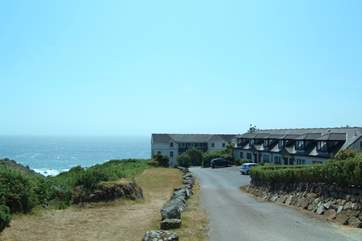 As you approach the end of the private road, the former Headland Hotel is straight ahead.