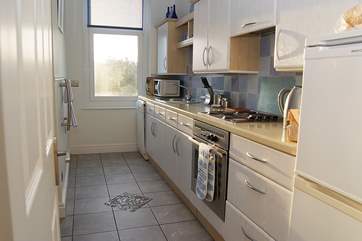 The well-equipped kitchen with a view.