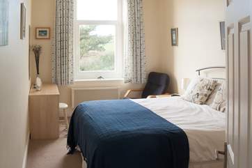 The master bedroom is comfortably furnished with a double bed (Bedroom 1).