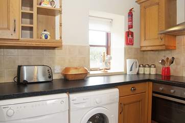 The kitchen is compact but well-equipped.