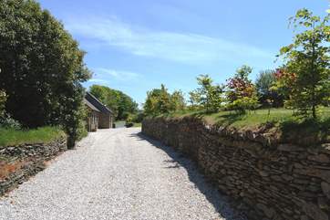 The pretty driveway leading to the cottages.