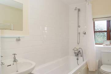 The modern white bathroom is fresh and light.