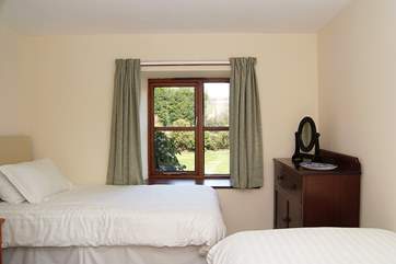 Like the other bedrooms and the bathroom, the twin bedroom (Bedroom 1) is on the lower ground floor.