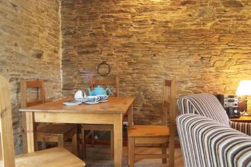 The dining-area is next to the door that leads out to the patio.
