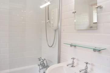 The modern white bathroom is fresh and light.