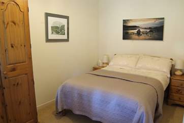The tastefully furnished bedroom.