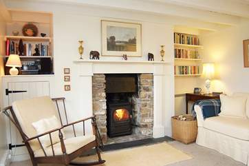 The spacious sitting/dining-room has a toasty wood-burning stove - perfect for cooler evenings.