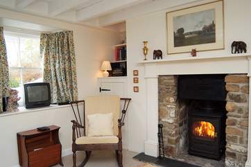The warming wood-burner adds to the charm of this lovely cottage.