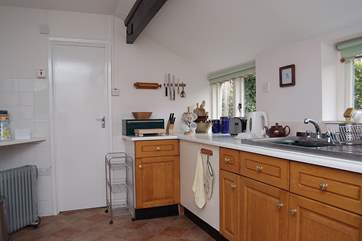 One end of the spacious kitchen, with the door into the bathroom.